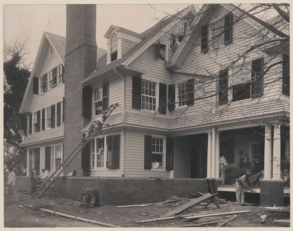 Students at work on a house built largely by them, 1899