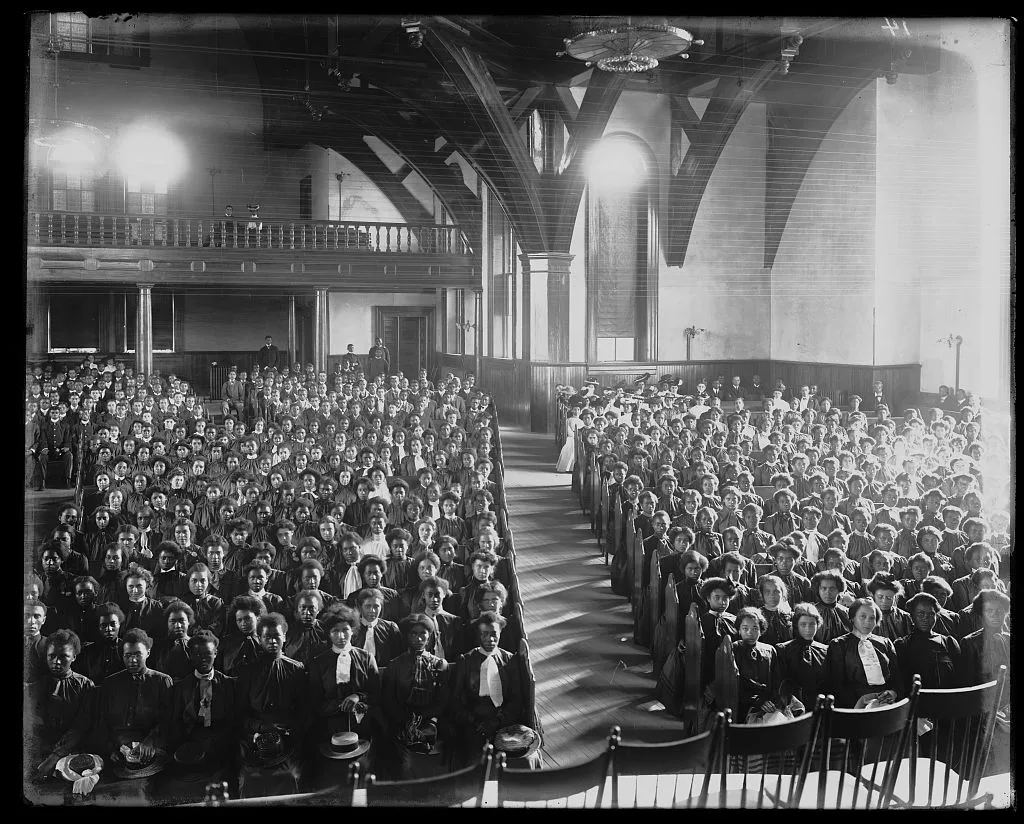 [Interior view of chapel filled with female students at the Tuskegee…, Tuskegee, Alabama, 1902