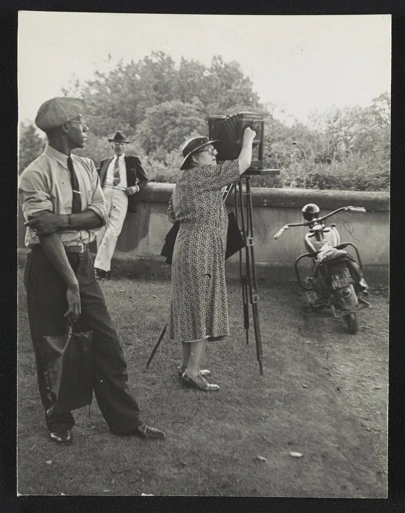 [Photographer Frances Benjamin Johnston standing beside her view…, North Carolina, Asheville, 1938