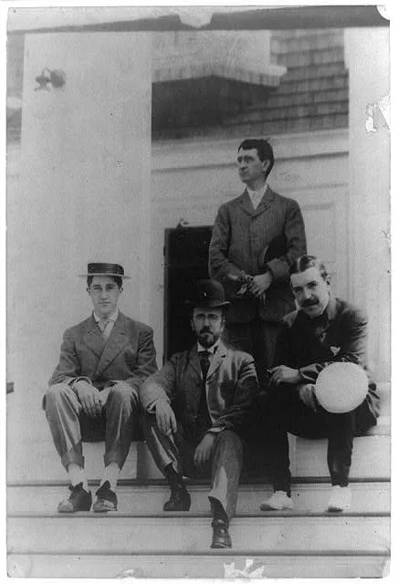 [Four men, friends of Frances Benjamin Johnston, posed on porch], 1900