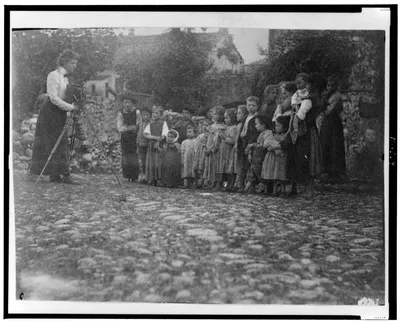 Photograph from 1900: [Frances Benjamin Johnston photographing a group…